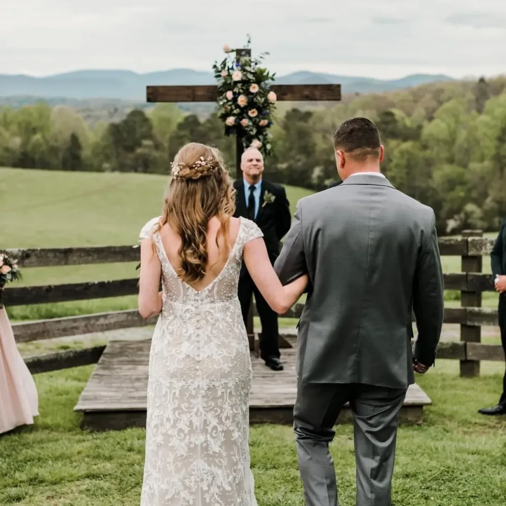 Bride and groom at outdoor wedding ceremony.